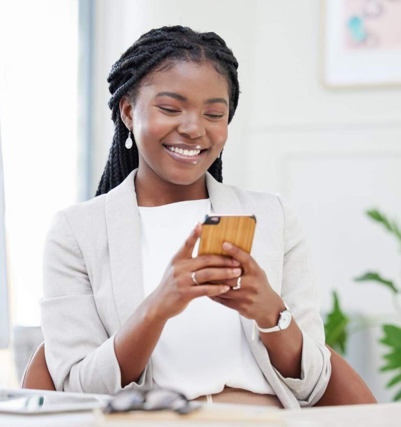 online-world-beckons-shot-beautiful-african-businesswoman-using-her-smartphone-send-text (1)